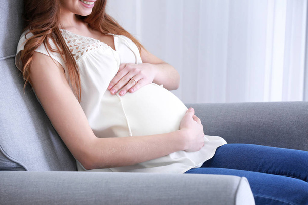 Beautiful pregnant woman sitting  - Zdjęcie, obraz