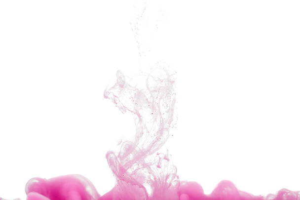 colorful ink isolated on white background. pink drop swirling under water. Cloud of ink in water. - Foto, immagini