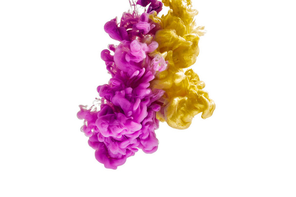 colorful ink isolated on white background. pink yellow  drop swirling under water. Cloud of ink in water. - Valokuva, kuva