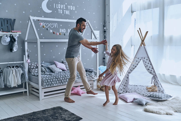 father and daughter dancing in bedroom - Zdjęcie, obraz