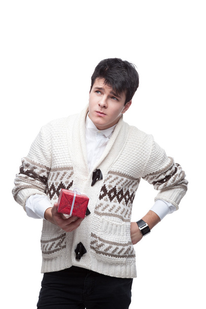 Funny casual winter man holding christmas gift - 写真・画像