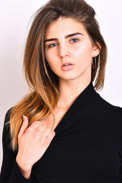 pretty cute sexy caucasian girl posing in black sweater - Foto, Imagen