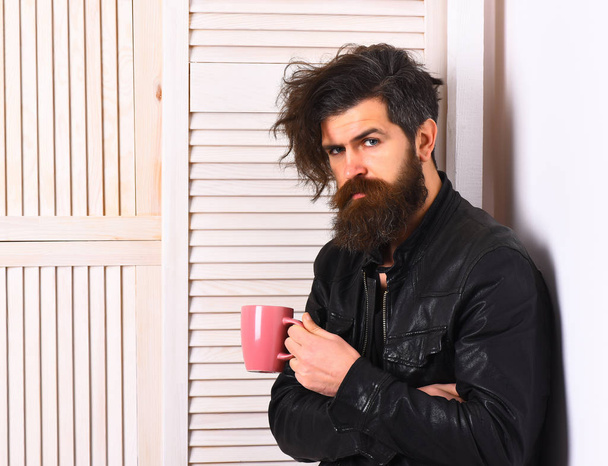 Brutal caucasian hipster holding cup or mug - Фото, зображення