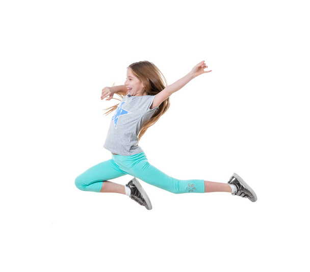 long-haired active girl dancing, isolated - Φωτογραφία, εικόνα