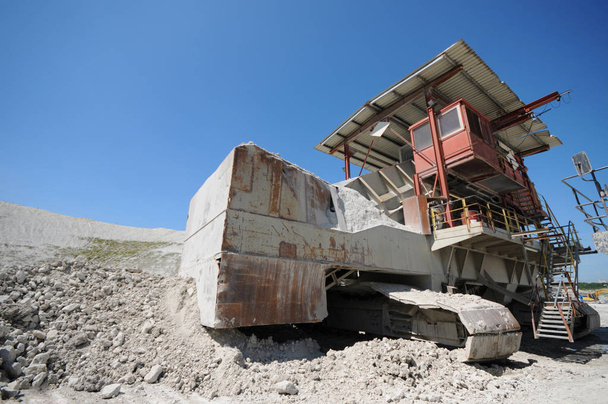 stone crusher machine in an open pit mine. mining industry - Photo, Image