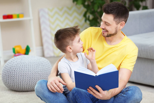Dad and son reading book  - Photo, Image