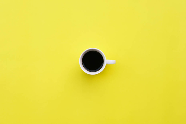 Cup of coffee on yellow background - Photo, Image