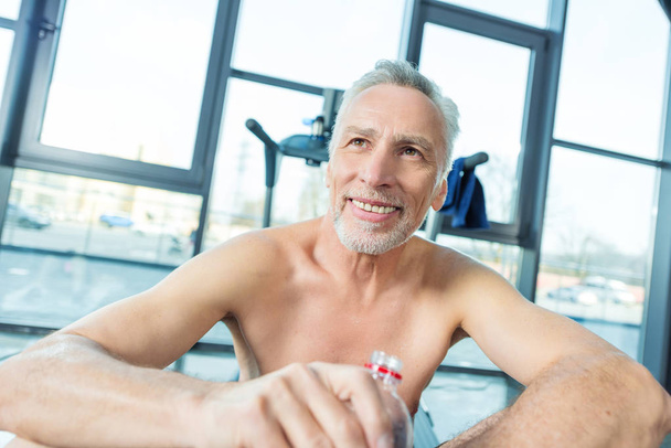 Mature sportsman in gym  - Photo, image