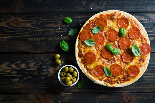 Pizza with pepperoni and basil - Photo, Image