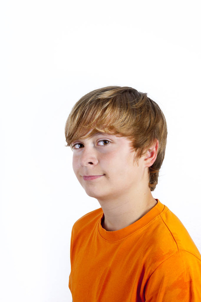 portrait of cute boy with orange shirt  - Photo, Image