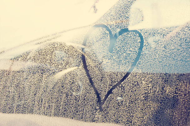 Sunny frozen car window and Love heart sign - Photo, Image