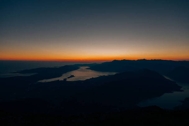 Sunset in the Bay of Kotor. Montenegrin sunsets. Sunset over the - Φωτογραφία, εικόνα