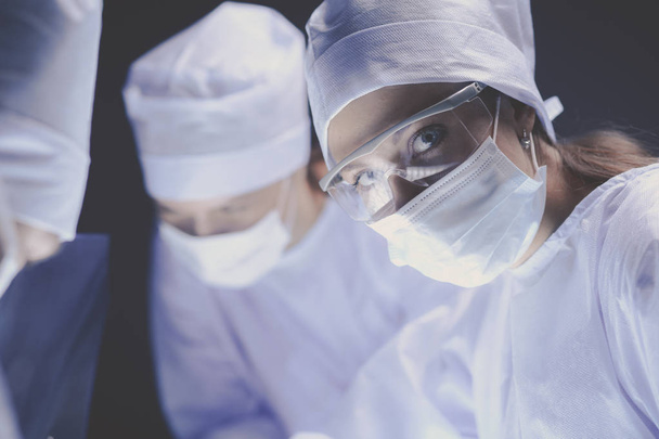 Team surgeon at work on operating in hospital - 写真・画像