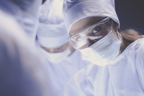 Team surgeon at work on operating in hospital - 写真・画像