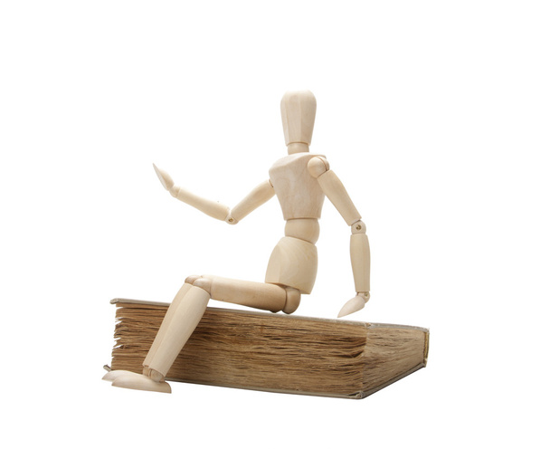 Wooden man and book - Photo, image