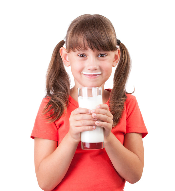 Little girl with a glass of buttermilk - Fotó, kép