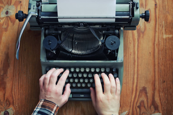 typewriter retro hand on wooden table - Photo, Image