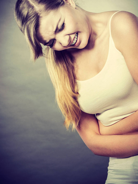 Woman suffer from belly pain. - Zdjęcie, obraz