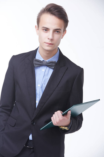 handsome young businessman with folder - Foto, imagen