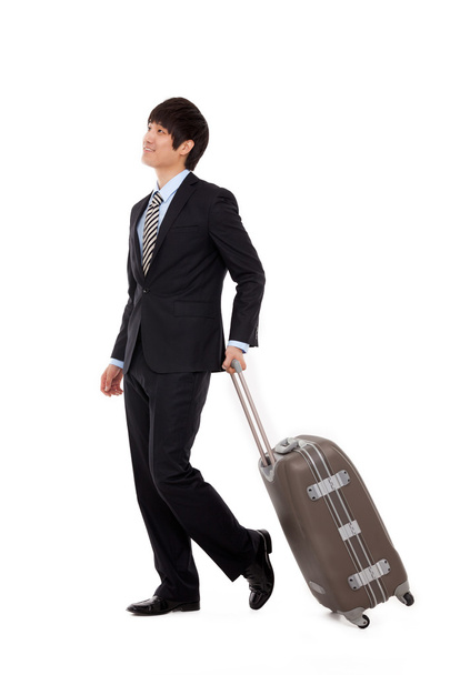 Empresario caminando a lo largo de algunos equipaje de viaje
 - Foto, imagen