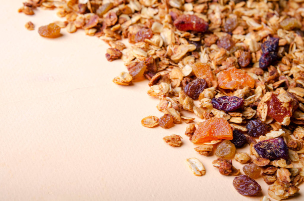 Homemade granola with honey, oatmeal, nuts, raisin, cranberry and dried apricots - Fotó, kép
