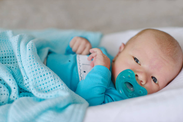 newborn with dummy - Zdjęcie, obraz