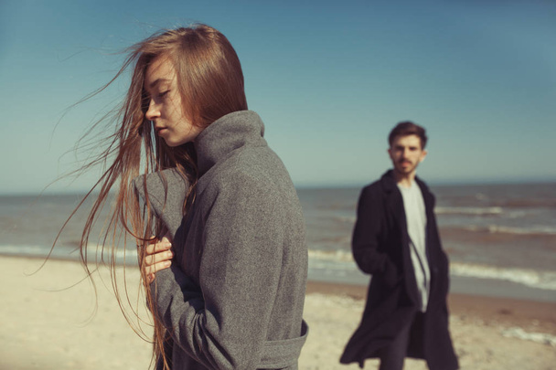 Young hipster couple posing near the sea in spring sunny day - Fotografie, Obrázek