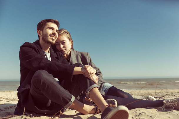 Young hipster couple in stpring sunny day posing on the beach.  - Zdjęcie, obraz
