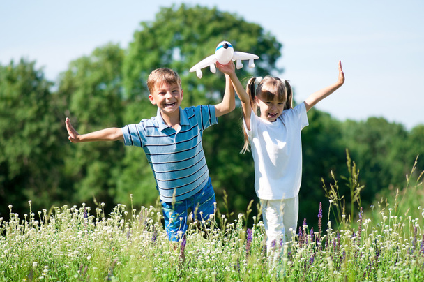 Happy children on meadow - Фото, изображение