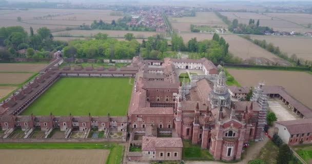 Aerial view of the Certosa di Pavia, built in the late fourteenth century, courts and the cloister of the monastery and shrine in the province of Pavia, Lombardia, Italy - Footage, Video