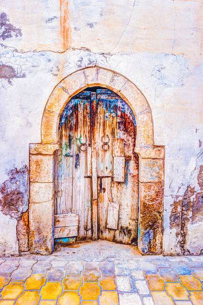 Traditional old painted door in a historical district or medina, Tunisia. - Φωτογραφία, εικόνα