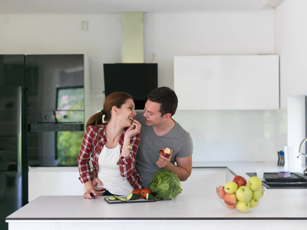 Young handsome couple in the kitchen - Foto, Bild