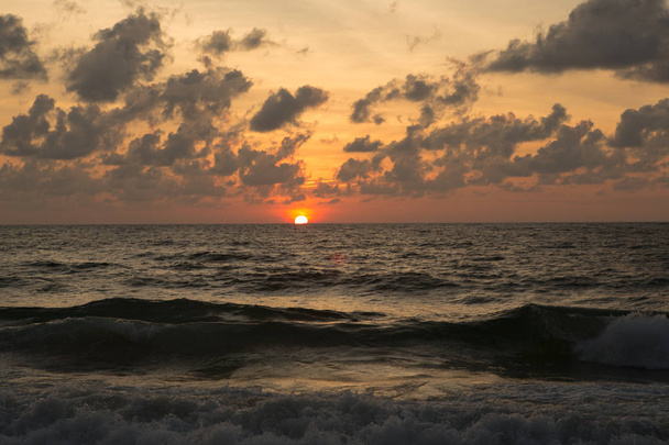 a beautiful sunset in the sea - Photo, image