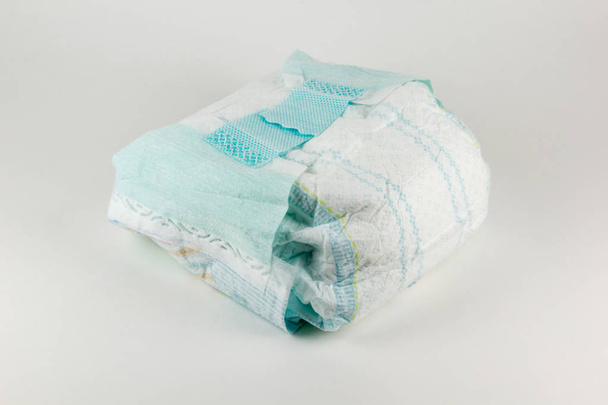 Full baby diaper on a white background - Photo, Image
