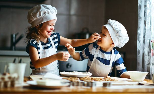 happy family funny kids bake cookies in kitchen - Foto, imagen