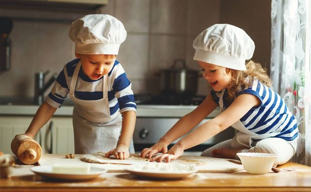 happy family funny kids bake cookies in kitchen - Фото, зображення