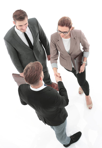 Handshake between business people in a modern office - Zdjęcie, obraz