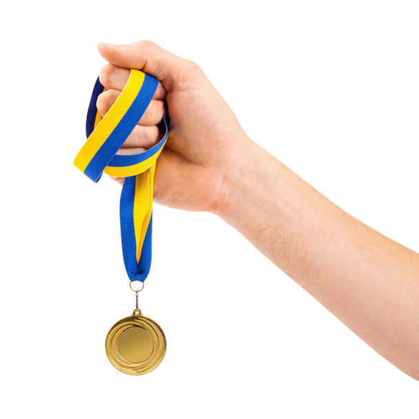 gold medal in hand on white background - Foto, Bild