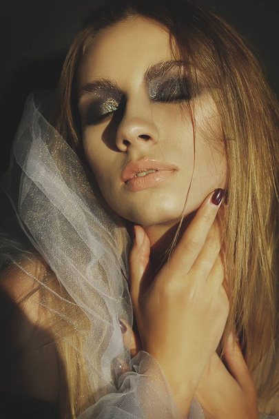 Beauty portrait of a young blond girl with smoky eyes makeup. Ar - Fotoğraf, Görsel