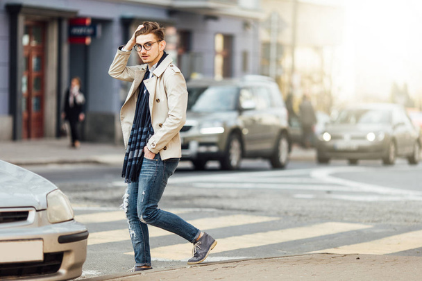 Fashionable man walking on the street with blur background - Foto, Imagen