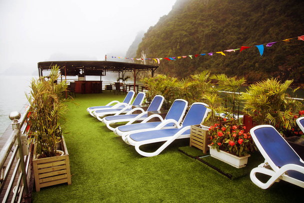 Lounge chairs on deck of luxury cruise ship - Photo, Image
