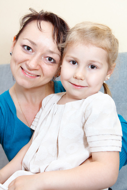 Portrait of mother with small daughter - Φωτογραφία, εικόνα