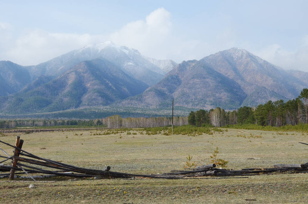 Spring pasture in the Tunkinskaya valley at the foot of Sayan Mountains, Buryatia - Photo, Image