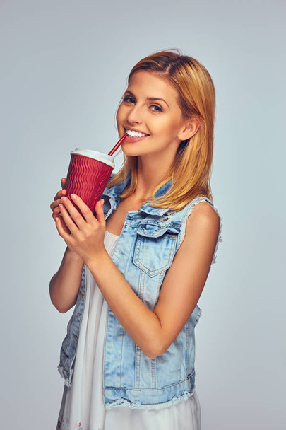 Girl holds paper red cup - Photo, Image