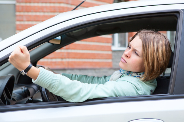 Woman in car making some bad gestures - Fotografie, Obrázek