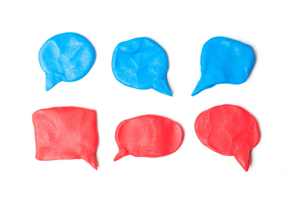 Plasticine red speech bubbles. Modeling clay handmade talk clouds isolated on white background. - Photo, Image