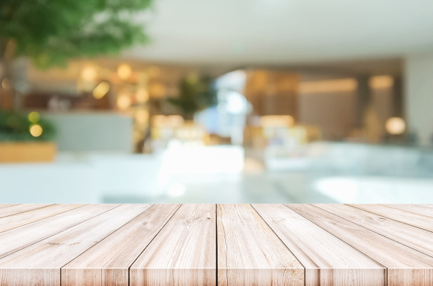 Üres fából készült asztallap homályos modern lobby háttér.  - Fotó, kép