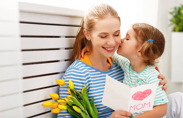 Happy mother's day! Child daughter congratulates moms and gives  - Фото, зображення