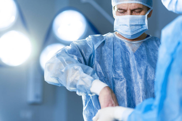 Serious doctor in operating room - Photo, Image