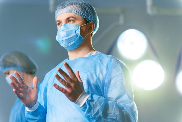 Attentive male doctor in operating-room - Zdjęcie, obraz